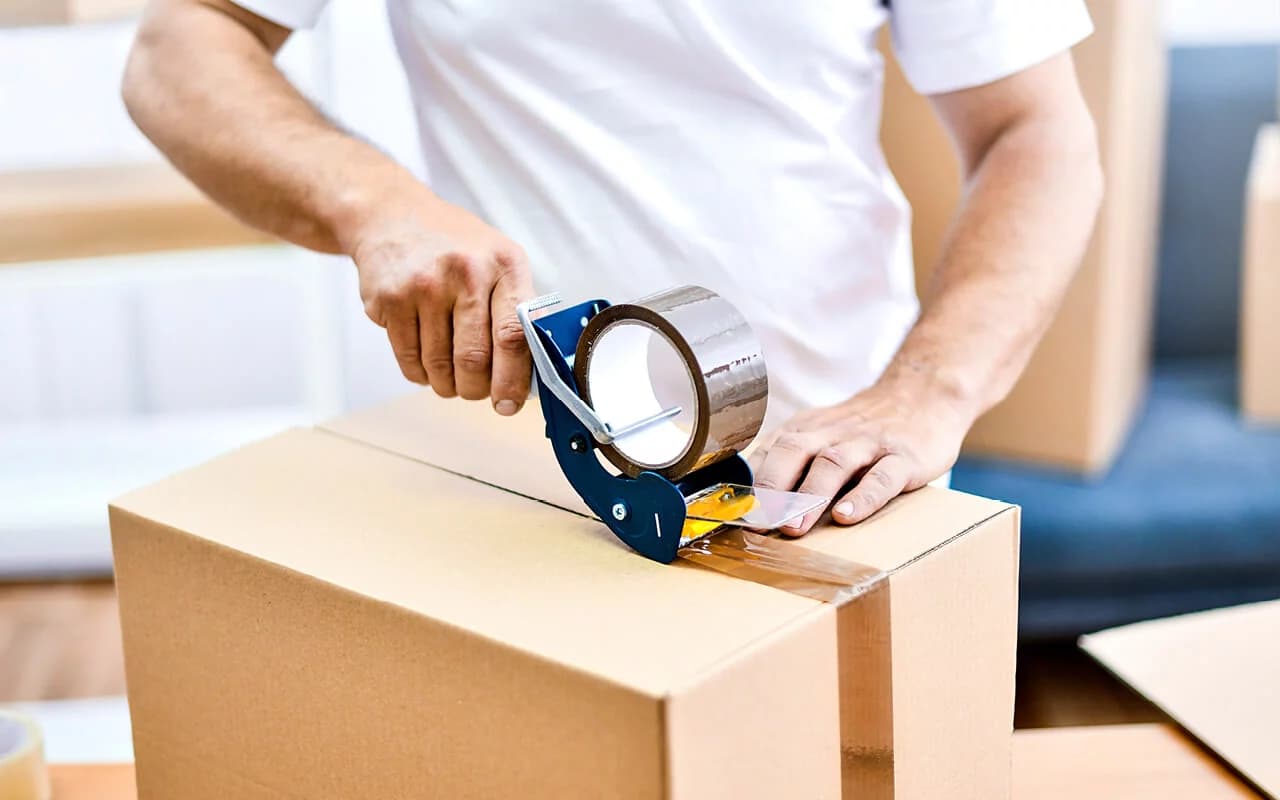 a guy packing the parcel