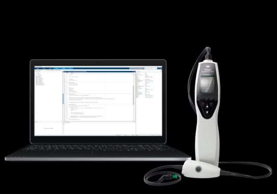 A computer with a device on it